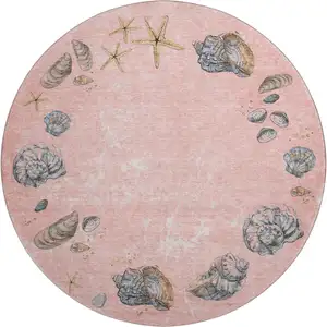 Photo of 8' Peach Gray And Ivory Geometric Washable Round Rug With UV Protection