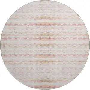 Photo of 8' Peach Ivory And Beige Geometric Washable Round Rug With UV Protection
