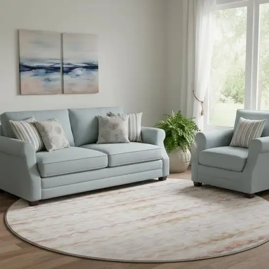 8' Peach Ivory And Beige Geometric Washable Round Rug With UV Protection Photo 1