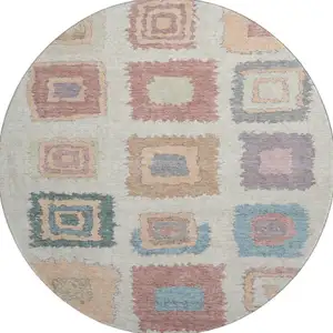 Photo of 8' Peach Ivory And Blue Geometric Washable Round Rug With UV Protection