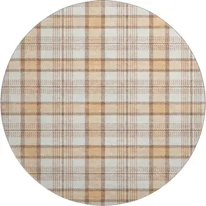 Photo of 8' Peach Ivory And Brown Plaid Washable Round Rug With UV Protection