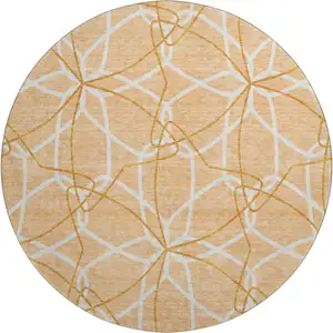 Photo of 8' Peach Ivory And Orange Geometric Washable Round Rug With UV Protection