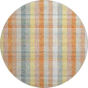 Photo of 8' Peach Ivory And Yellow Plaid Washable Round Rug With UV Protection