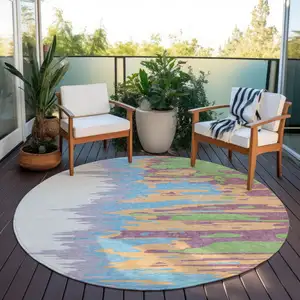 Photo of 8' Peach Purple And Green Round Abstract Washable Indoor Outdoor Area Rug