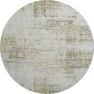 Photo of 8' Pearl Gold And Green Abstract Washable Round Rug With UV Protection