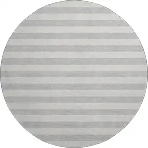 Photo of 8' Pewter And Gray Striped Washable Round Rug With UV Protection