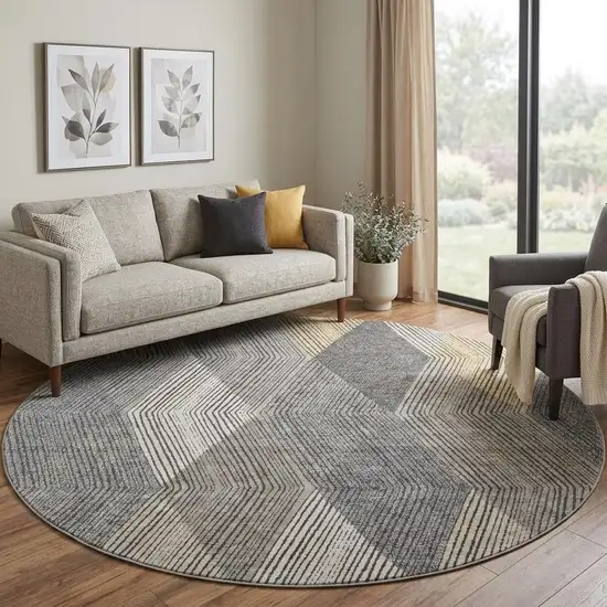 8' Pewter Gold And Ivory Geometric Washable Round Rug With UV Protection Photo 1