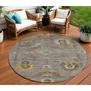 Photo of 8' Pewter Gray And Gold Round Floral Medallion Washable Indoor Outdoor Area Rug