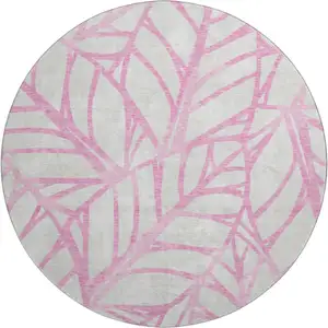 Photo of 8' Pink And Beige Floral Washable Round Rug With UV Protection