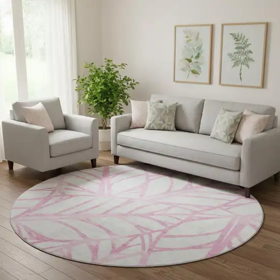 8' Pink And Beige Floral Washable Round Rug With UV Protection Photo 1