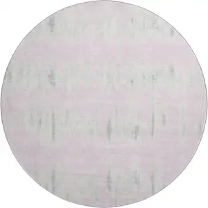 Photo of 8' Pink And Beige Striped Washable Round Rug With UV Protection
