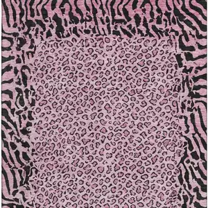Photo of 8' Pink And Black Animal Print Washable Area Rug With UV Protection