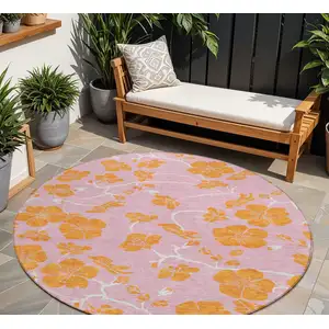 Photo of 8' Pink And Copper Round Floral Washable Indoor Outdoor Area Rug