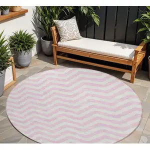 Photo of 8' Pink And Gray Round Chevron Washable Indoor Outdoor Area Rug