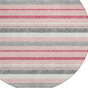 Photo of 8' Pink And Gray Round Striped Washable Indoor Outdoor Area Rug
