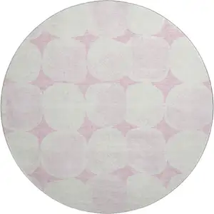 Photo of 8' Pink And Ivory Abstract Geometric Washable Round Rug With UV Protection
