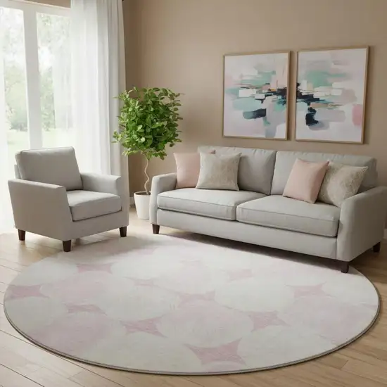 8' Pink And Ivory Abstract Geometric Washable Round Rug With UV Protection Photo 1
