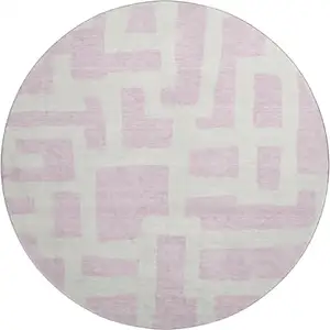 Photo of 8' Pink And Ivory Abstract Geometric Washable Round Rug With UV Protection