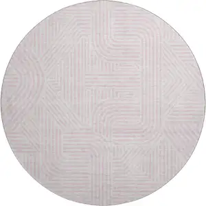 Photo of 8' Pink And Ivory Abstract Geometric Washable Round Rug With UV Protection