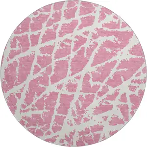 Photo of 8' Pink And Ivory Abstract Washable Round Rug With UV Protection