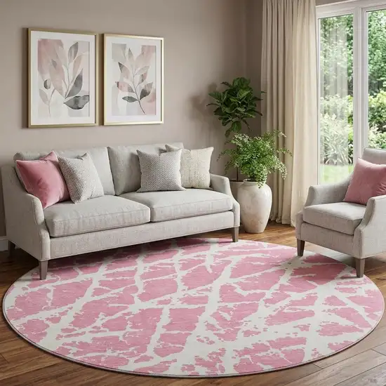 8' Pink And Ivory Abstract Washable Round Rug With UV Protection Photo 1
