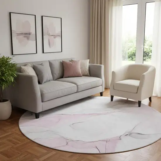 8' Pink And Ivory Abstract Washable Round Rug With UV Protection Photo 1