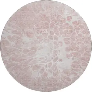 Photo of 8' Pink And Ivory Abstract Washable Round Rug With UV Protection