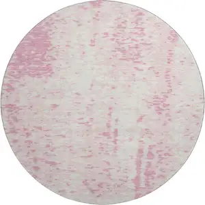 Photo of 8' Pink And Ivory Abstract Washable Round Rug With UV Protection