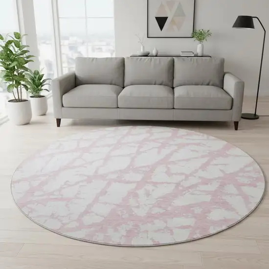8' Pink And Ivory Abstract Washable Round Rug With UV Protection Photo 2