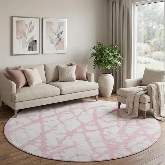 8' Pink And Ivory Abstract Washable Round Rug With UV Protection Photo 1