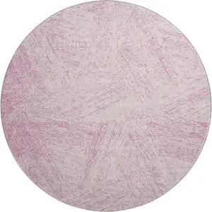 Photo of 8' Pink And Ivory Abstract Washable Round Rug With UV Protection