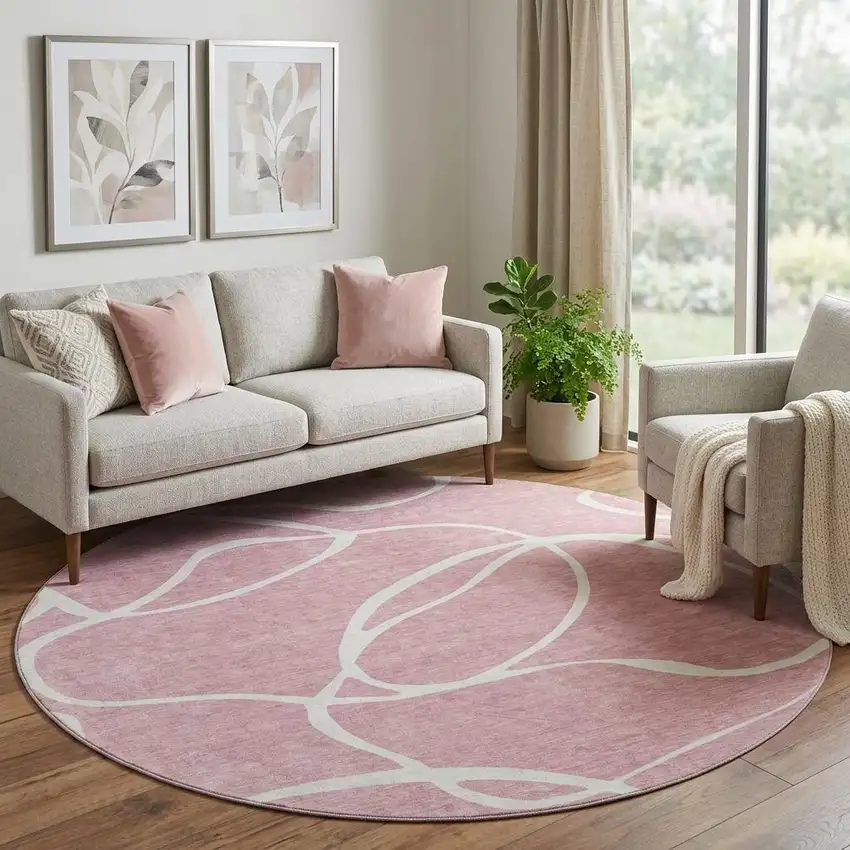 8' Pink And Ivory Abstract Washable Round Rug With UV Protection Photo 1