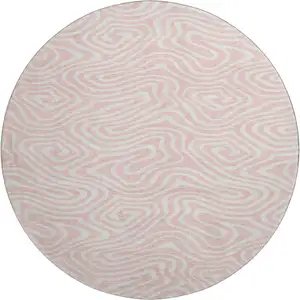 Photo of 8' Pink And Ivory Abstract Washable Round Rug With UV Protection
