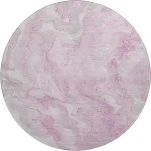 Photo of 8' Pink And Ivory Abstract Washable Round Rug With UV Protection