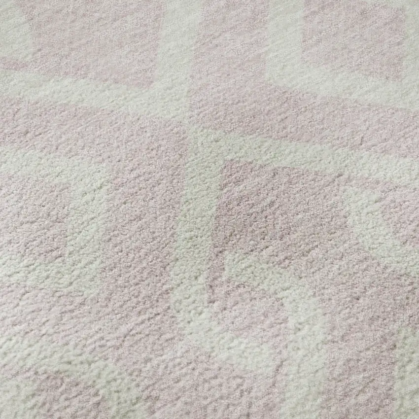 8' Pink And Ivory Geometric Washable Round Rug With UV Protection Photo 9