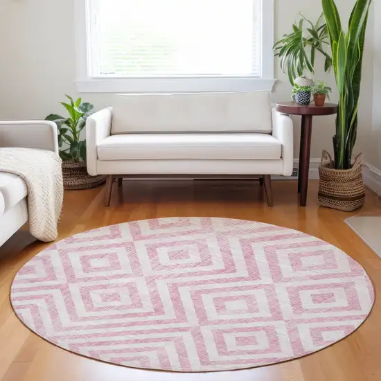 8' Pink And Ivory Geometric Washable Round Rug With UV Protection Photo 4