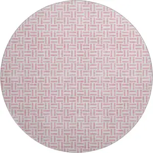 Photo of 8' Pink And Ivory Geometric Washable Round Rug With UV Protection