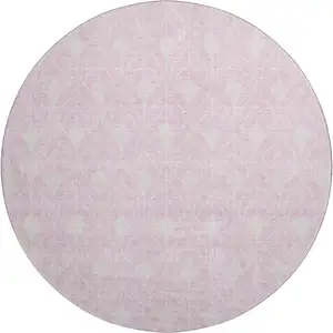 Photo of 8' Pink And Ivory Geometric Washable Round Rug With UV Protection