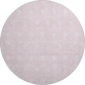 Photo of 8' Pink And Ivory Geometric Washable Round Rug With UV Protection