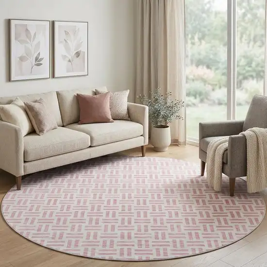 8' Pink And Ivory Geometric Washable Round Rug With UV Protection Photo 1