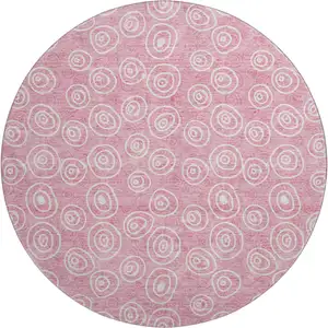 Photo of 8' Pink And Ivory Polka Dot Washable Round Rug With UV Protection