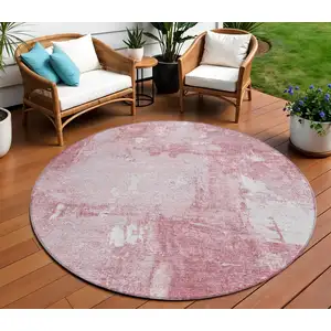 Photo of 8' Pink And Ivory Round Abstract Washable Indoor Outdoor Area Rug