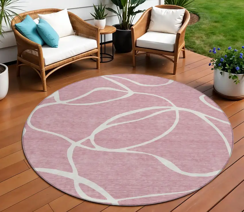 8' Pink And Ivory Round Abstract Washable Indoor Outdoor Area Rug Photo 1
