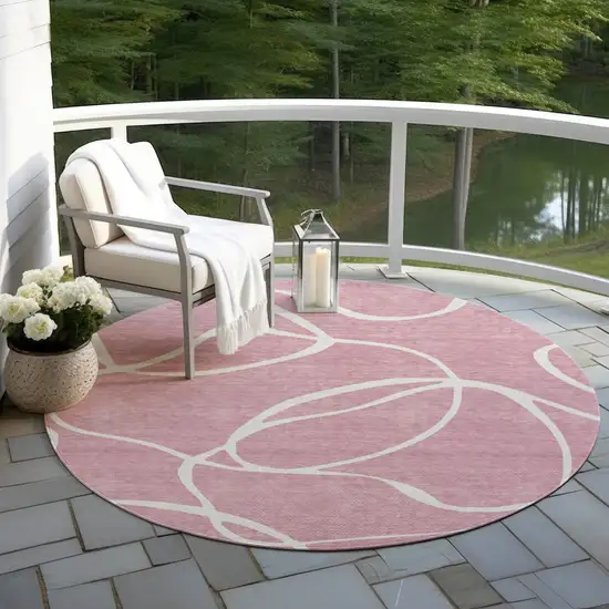 8' Pink And Ivory Round Abstract Washable Indoor Outdoor Area Rug Photo 7