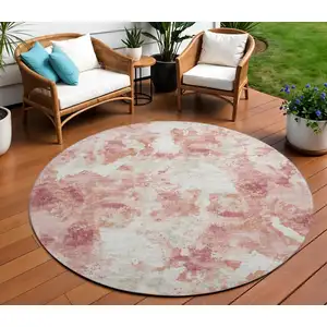 Photo of 8' Pink And Ivory Round Abstract Washable Indoor Outdoor Area Rug