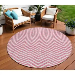 Photo of 8' Pink And Ivory Round Chevron Washable Indoor Outdoor Area Rug