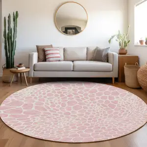 Photo of 8' Pink And Ivory Round Geometric Washable Indoor Outdoor Area Rug