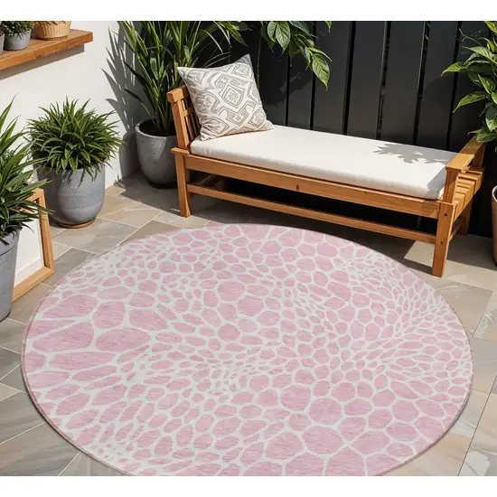8' Pink And Ivory Round Geometric Washable Indoor Outdoor Area Rug Photo 1