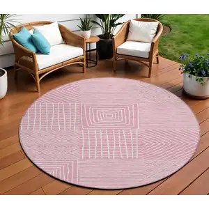 Photo of 8' Pink And Ivory Round Geometric Washable Indoor Outdoor Area Rug