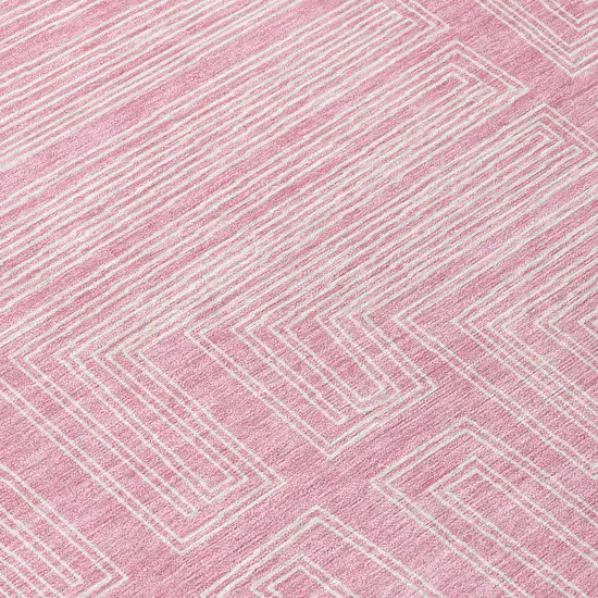 8' Pink And Ivory Round Geometric Washable Indoor Outdoor Area Rug Photo 9